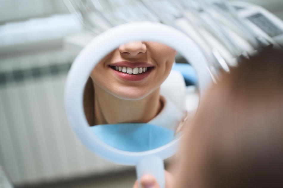 Woman with mirror at dentist stock photo 2023 11 27 05 28 02 utc